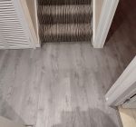 Harrow 8mm Laminate Flooring colour Wildwood Oak supplied and fitted to Hall, Living room and Dining room.
